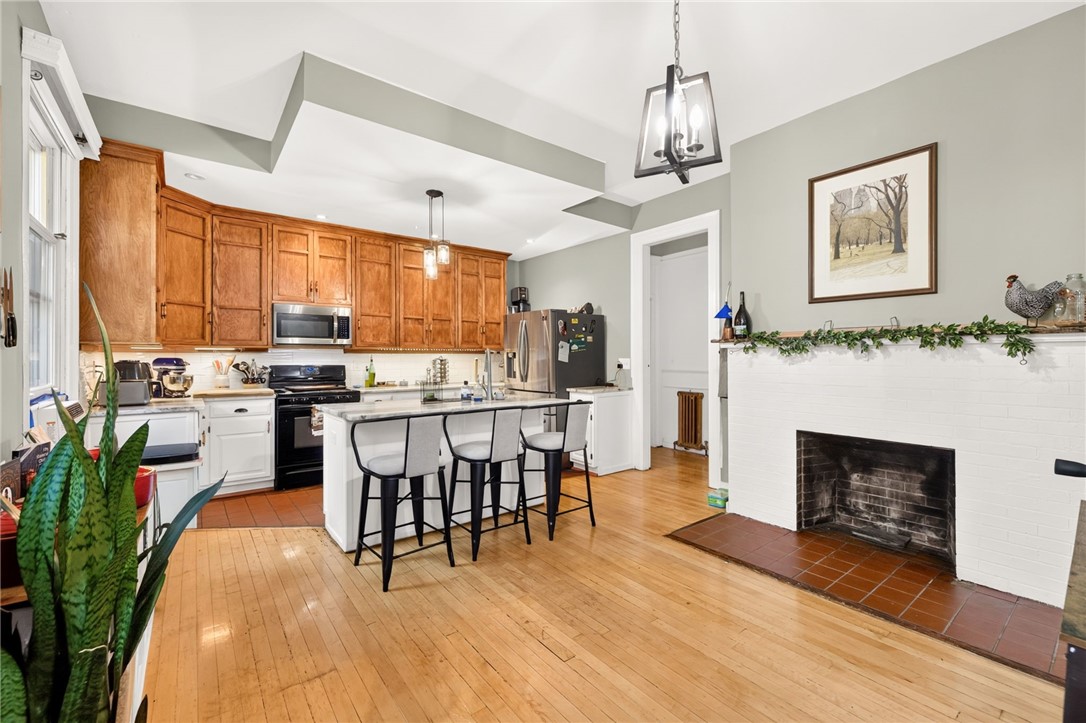32-34 Strathallan Park Rochester, NY 14607 - Photo 7 of 50 Huge eat-in kitchen with island & bar seating