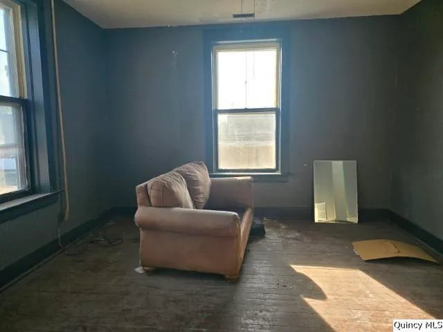 a room with chairs and closet