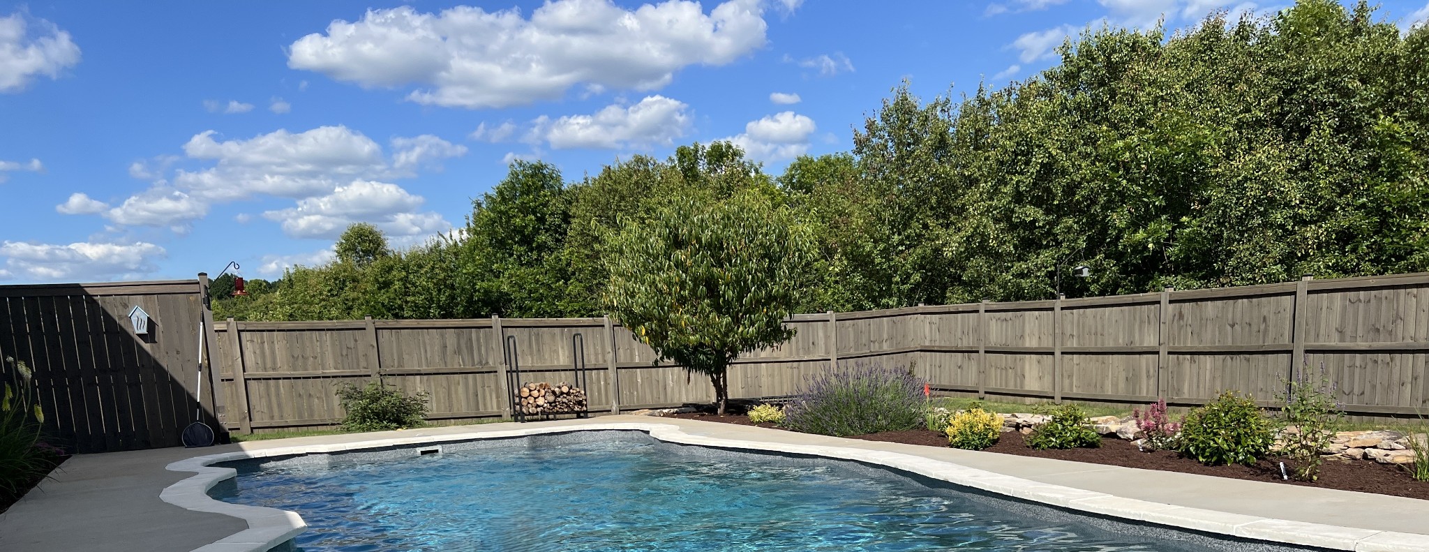 a backyard of a house with lots of green space