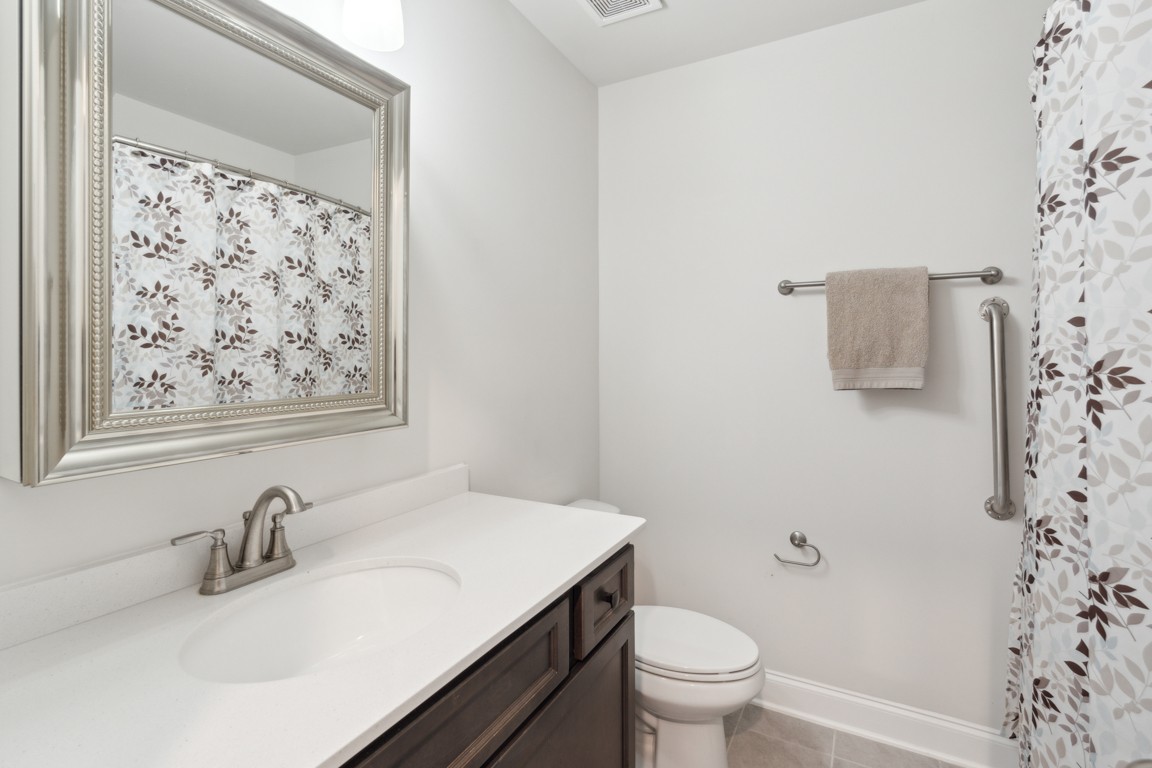 709 Mercer Road Mount Juliet, TN 37122 - Photo 25 of 40 a bathroom with a sink toilet and a mirror