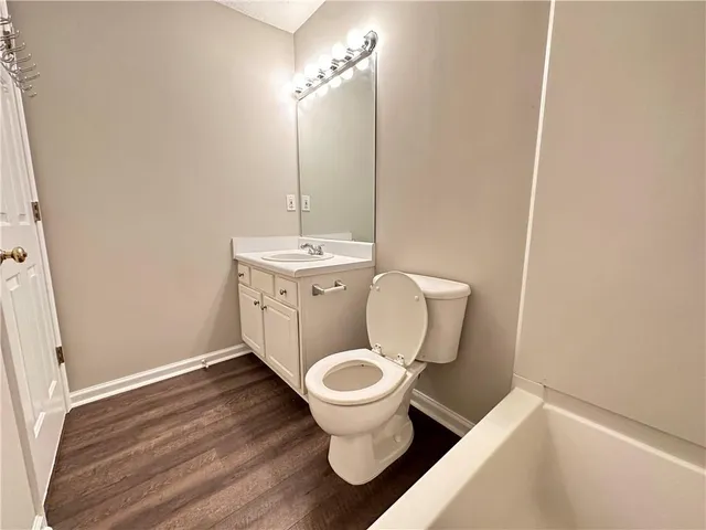 a bathroom with a toilet and a sink