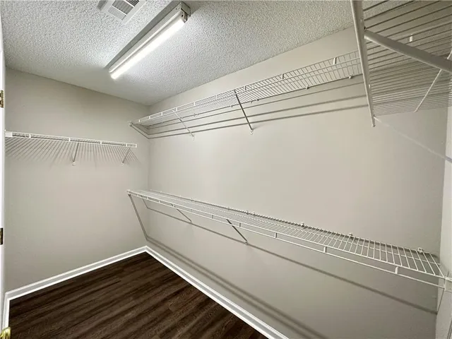 a view of a room with racks on the wall