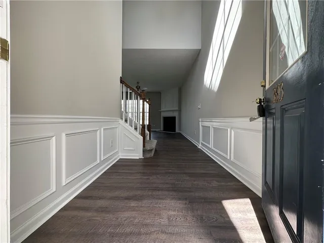 a view of an entryway with wooden floor