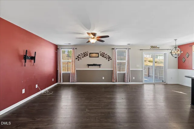 a bathroom with a toilet a sink and a mirror