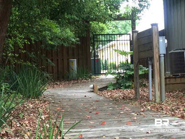 25773 Canal Road, Unit 26 Orange Beach, AL 36561 - Photo 31 of 42 Walk through the coded gate to one of the best restaurants on the island