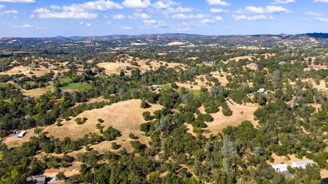 a view of a backyard of a house
