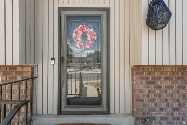 3951 Brixton Road Salt Lake City, UT 84129 - Photo 5 of 22 Front entry featuring vertical siding and brick accents