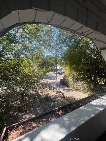 a view of a yard with an outdoor space