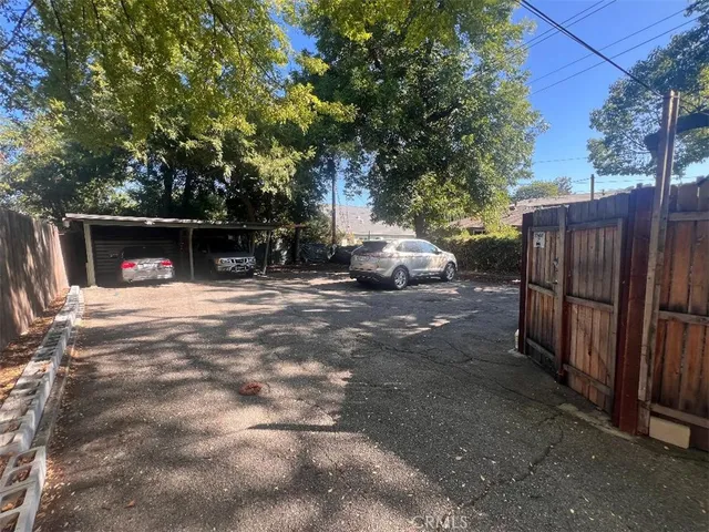 a view of street with parked cars