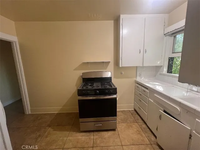 a kitchen with a stove and a sink