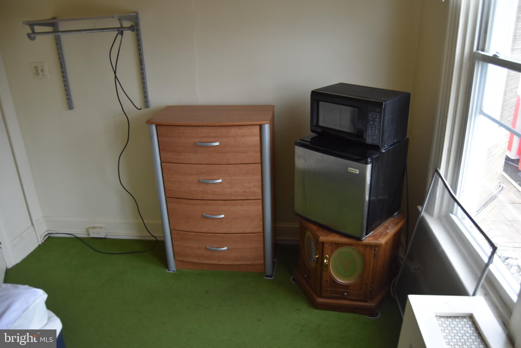 1241 North George Street York, PA 17404 - Photo 5 of 7 a living room with furniture and a flat screen tv
