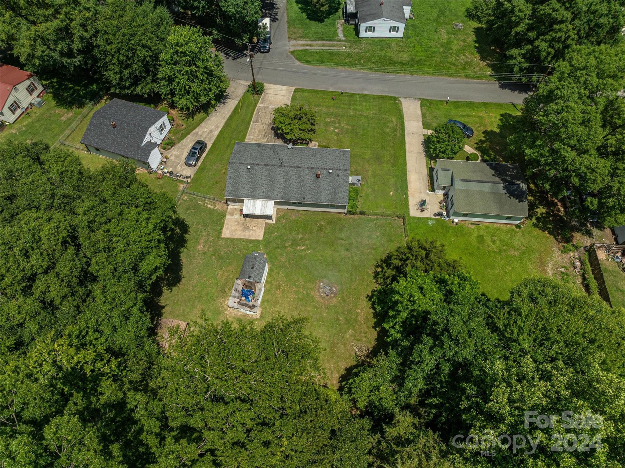 2729 Springbrook Circle Gastonia, NC 28052 - Photo 21 of 34 an aerial view of a house with outdoor space and trees all around