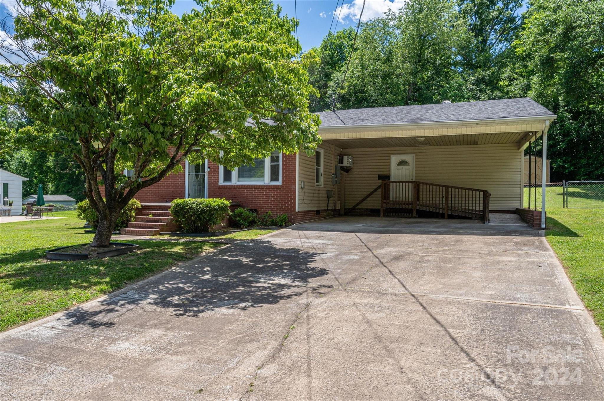 2729 Springbrook Circle Gastonia, NC 28052 - Photo 22 of 34 a front view of a house with a yard