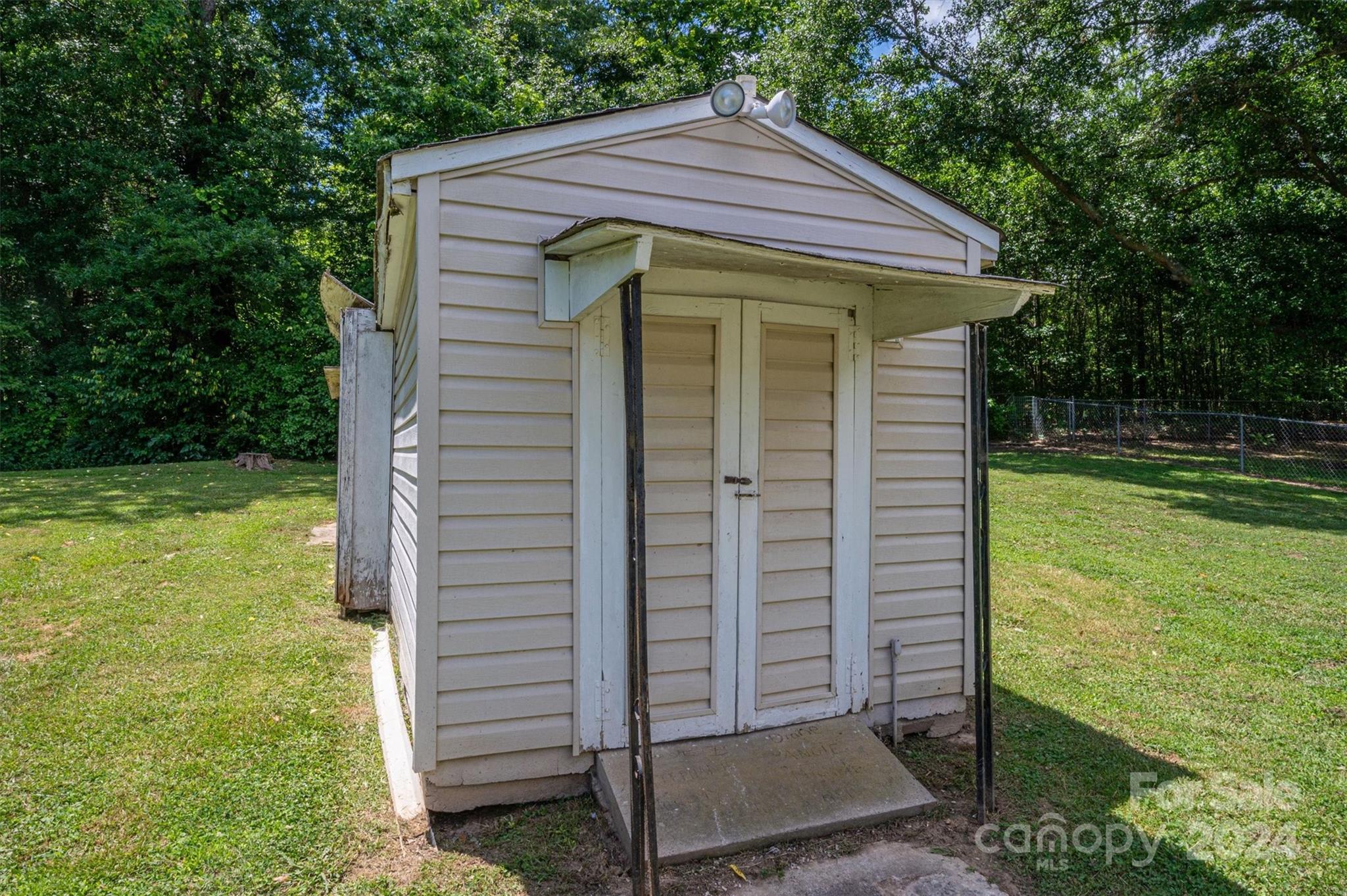 2729 Springbrook Circle Gastonia, NC 28052 - Photo 26 of 34 a front view of a house with garden
