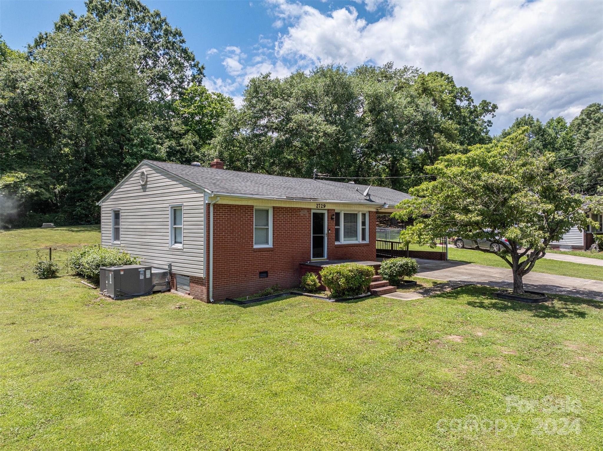 2729 Springbrook Circle Gastonia, NC 28052 - Photo 3 of 34 a view of a house with a yard and sitting area