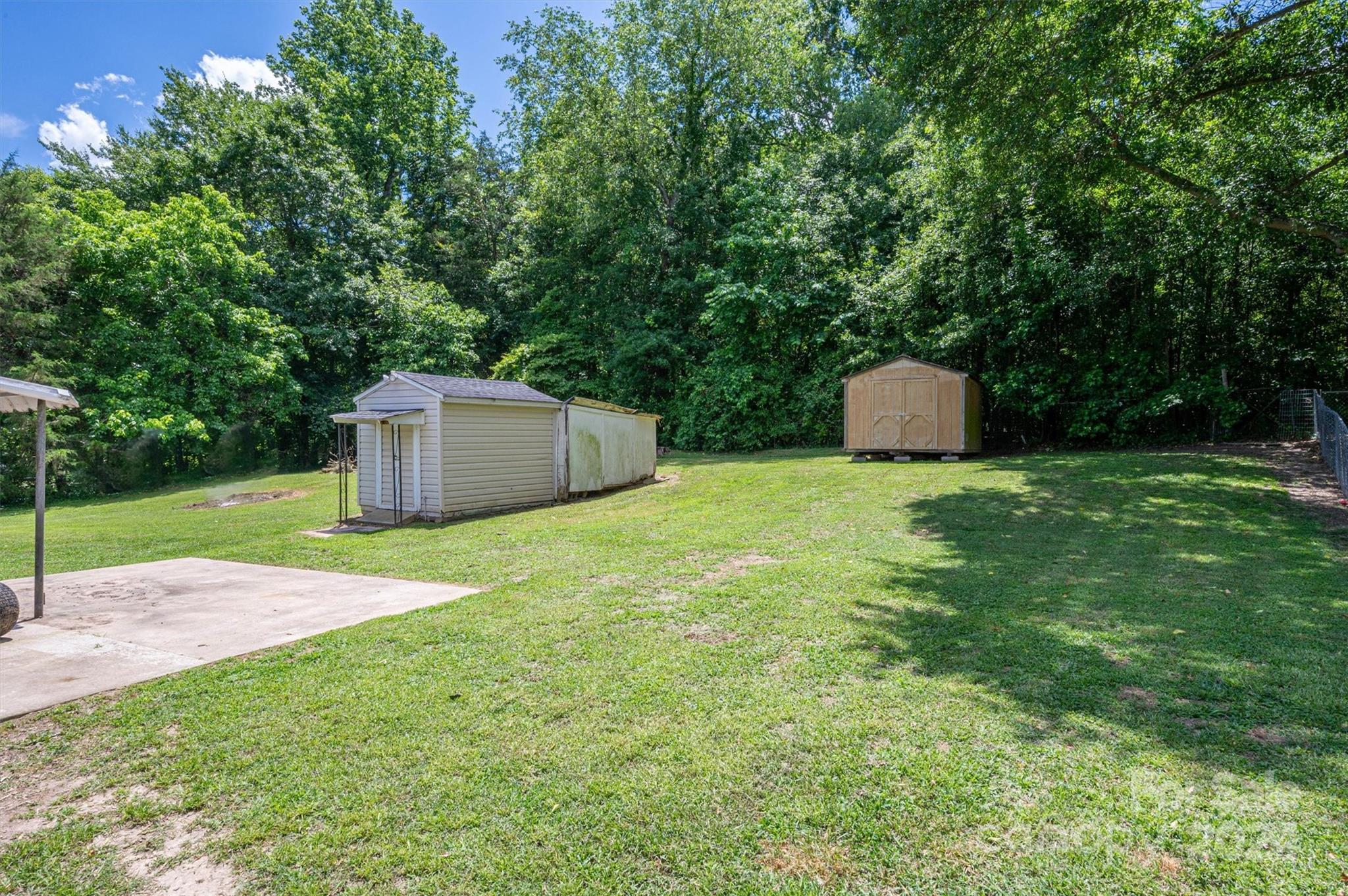 2729 Springbrook Circle Gastonia, NC 28052 - Photo 31 of 34 a view of a backyard with a garden and entertaining space
