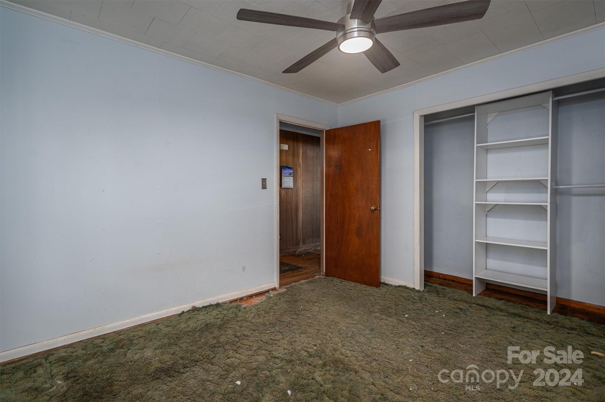 2729 Springbrook Circle Gastonia, NC 28052 - Photo 9 of 34 a view of an empty room with a ceiling fan
