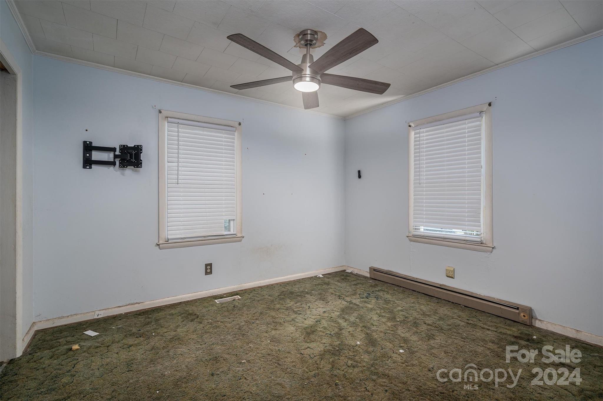 2729 Springbrook Circle Gastonia, NC 28052 - Photo 10 of 34 a view of a livingroom with a ceiling fan and wooden floor