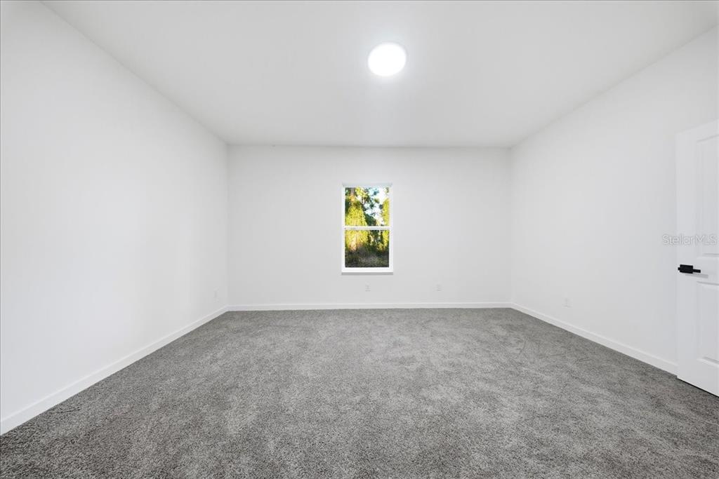 6464 Ohio Rd Port North Port, FL 34291 - Photo 17 of 35 an empty room with windows