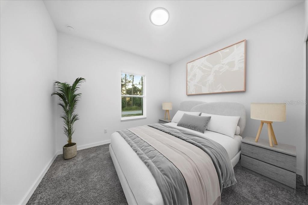 6464 Ohio Rd Port North Port, FL 34291 - Photo 23 of 35 a bedroom with a bed and a potted plant