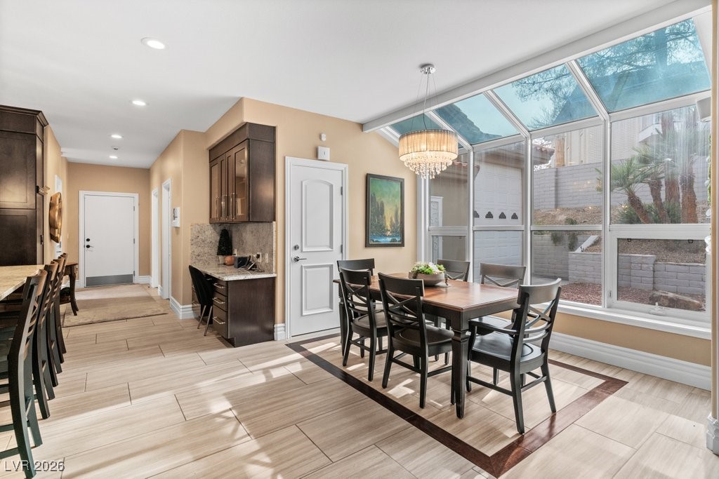 7 Larkside Court Henderson, NV 89014 - Photo 17 of 70 Dining room with wood finish floors, a chandelier, and recessed lighting
