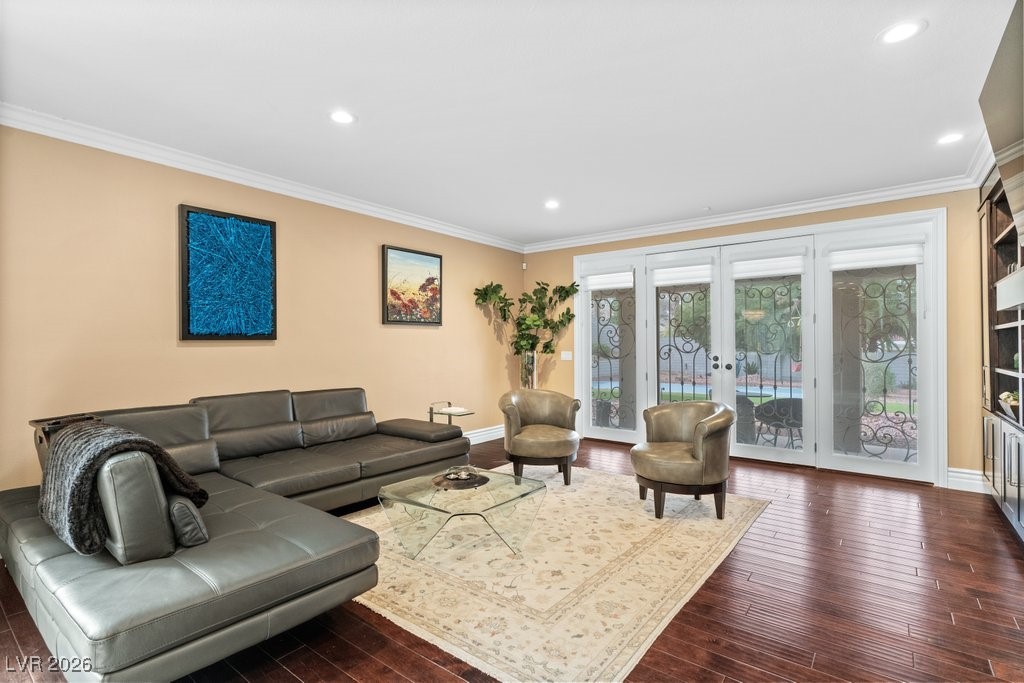 7 Larkside Court Henderson, NV 89014 - Photo 18 of 70 Living area with crown molding, dark wood-type flooring, french doors, and recessed lighting