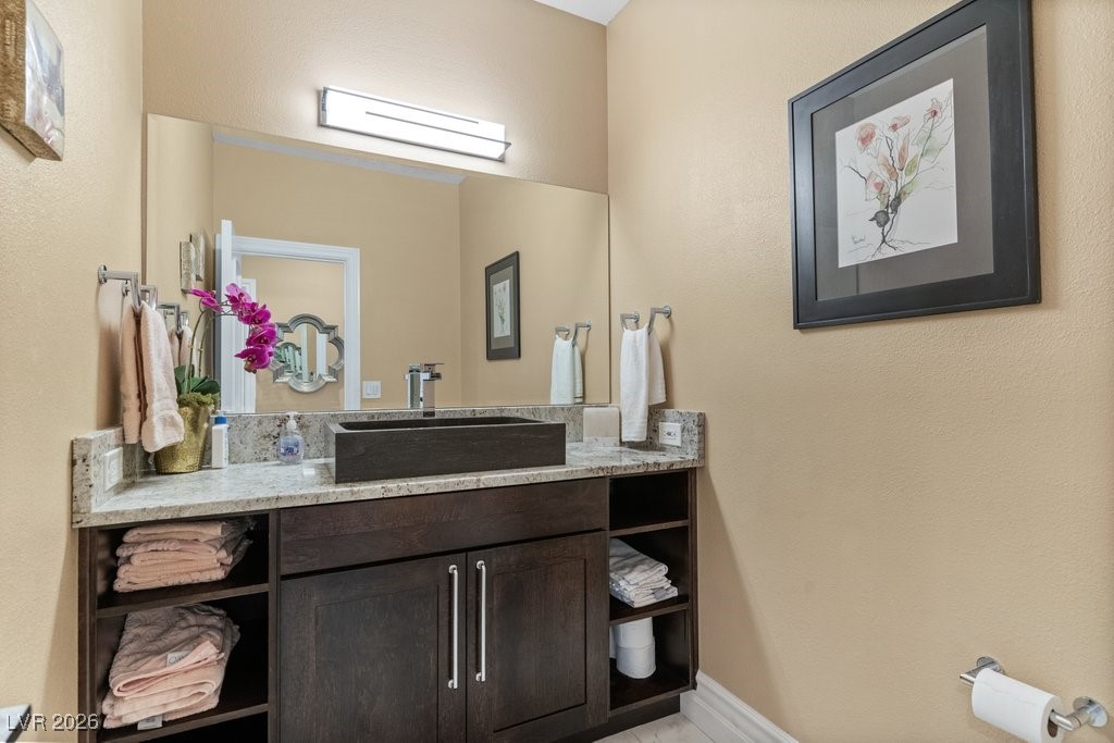 7 Larkside Court Henderson, NV 89014 - Photo 21 of 70 Bathroom with vanity and a textured wall