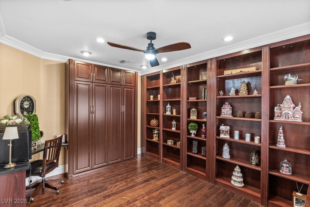 7 Larkside Court Henderson, NV 89014 - Photo 23 of 70 Office space featuring crown molding, dark wood-style flooring, a ceiling fan, recessed lighting, and built in shelves
