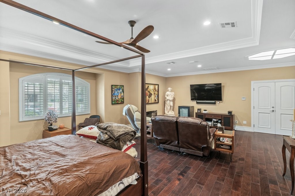 7 Larkside Court Henderson, NV 89014 - Photo 30 of 70 Bedroom featuring recessed lighting, wood finish floors, ceiling fan, ornamental molding, and a tray ceiling