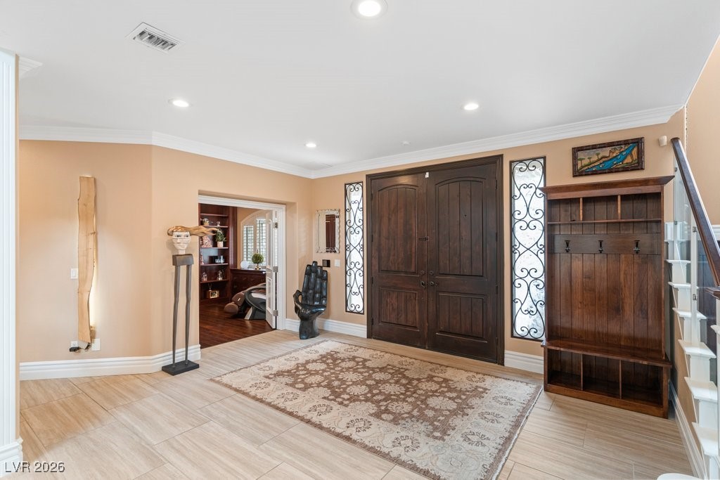 7 Larkside Court Henderson, NV 89014 - Photo 3 of 70 Entryway featuring crown molding, wood finish floors, and recessed lighting