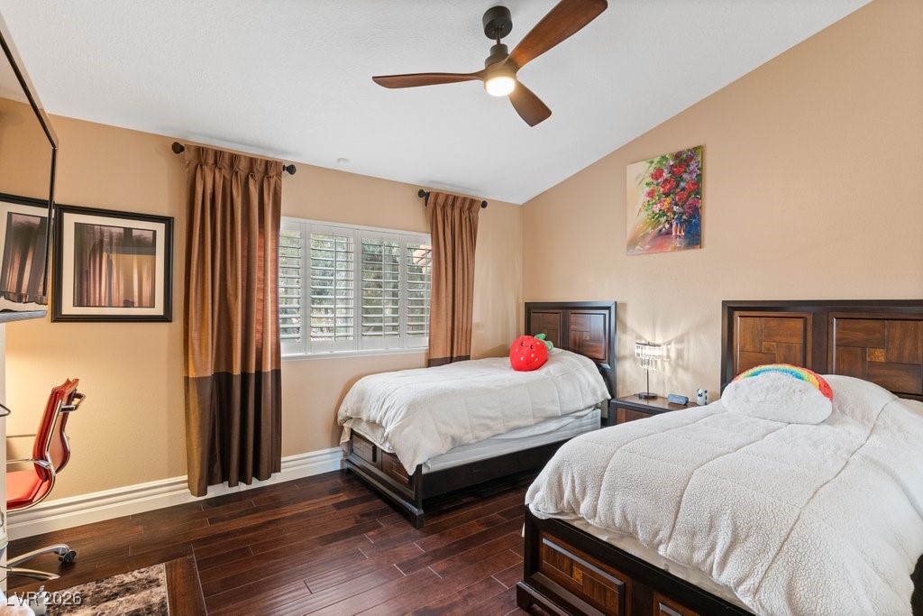 7 Larkside Court Henderson, NV 89014 - Photo 38 of 70 Bedroom with dark wood-style flooring, ceiling fan, and vaulted ceiling