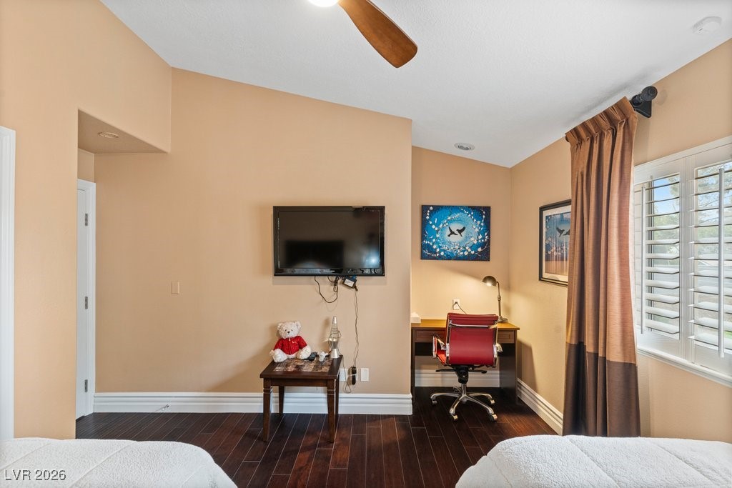 7 Larkside Court Henderson, NV 89014 - Photo 39 of 70 Bedroom with hardwood / wood-style floors, a ceiling fan, lofted ceiling, built in study area, and a baseboard heating unit
