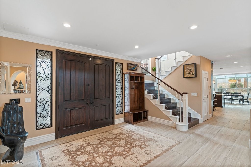 7 Larkside Court Henderson, NV 89014 - Photo 4 of 70 Foyer entrance with stairs, recessed lighting, and crown molding
