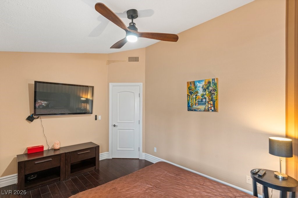7 Larkside Court Henderson, NV 89014 - Photo 48 of 70 Bedroom featuring dark wood finished floors, ceiling fan, and lofted ceiling
