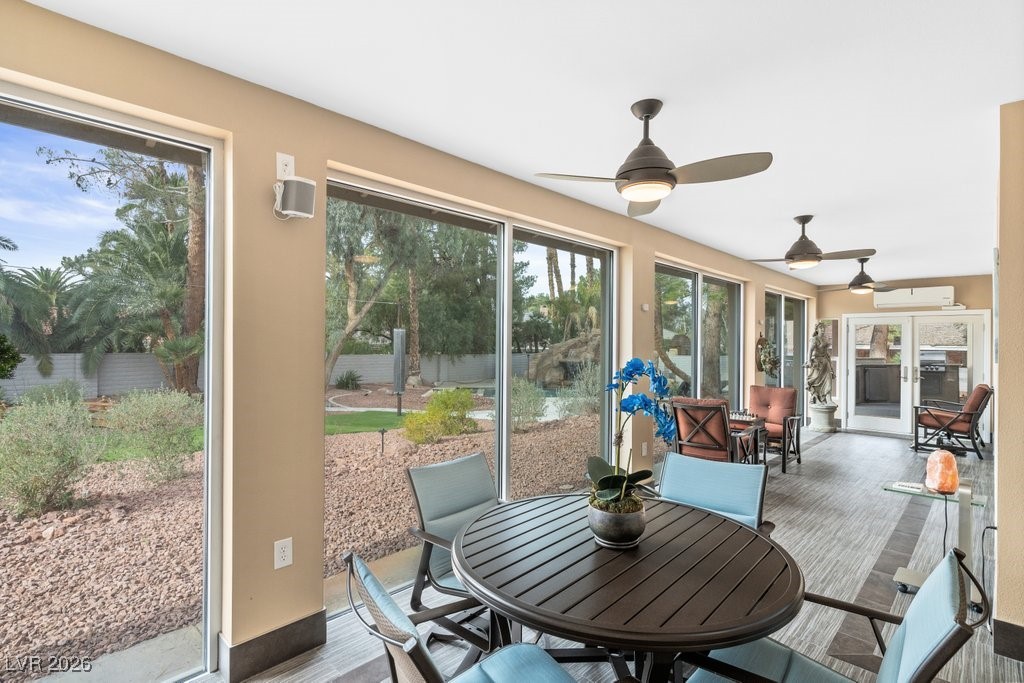 7 Larkside Court Henderson, NV 89014 - Photo 51 of 70 Sunroom / solarium with outdoor dining space, a ceiling fan, a patio, and wood finished floors