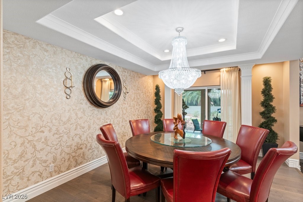 7 Larkside Court Henderson, NV 89014 - Photo 9 of 70 Dining space with crown molding, a chandelier, dark wood finished floors, and recessed lighting