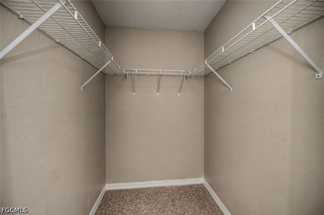 4104 13th Street Southwest Lehigh Acres, FL 33976 - Photo 16 of 46 a view of an empty walk in closet