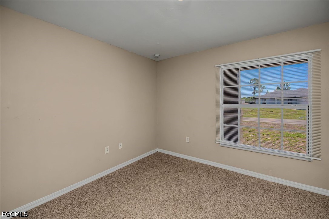 4104 13th Street Southwest Lehigh Acres, FL 33976 - Photo 25 of 46 an empty room with a window