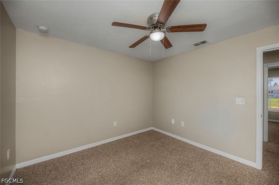 4104 13th Street Southwest Lehigh Acres, FL 33976 - Photo 27 of 46 an empty room with a window