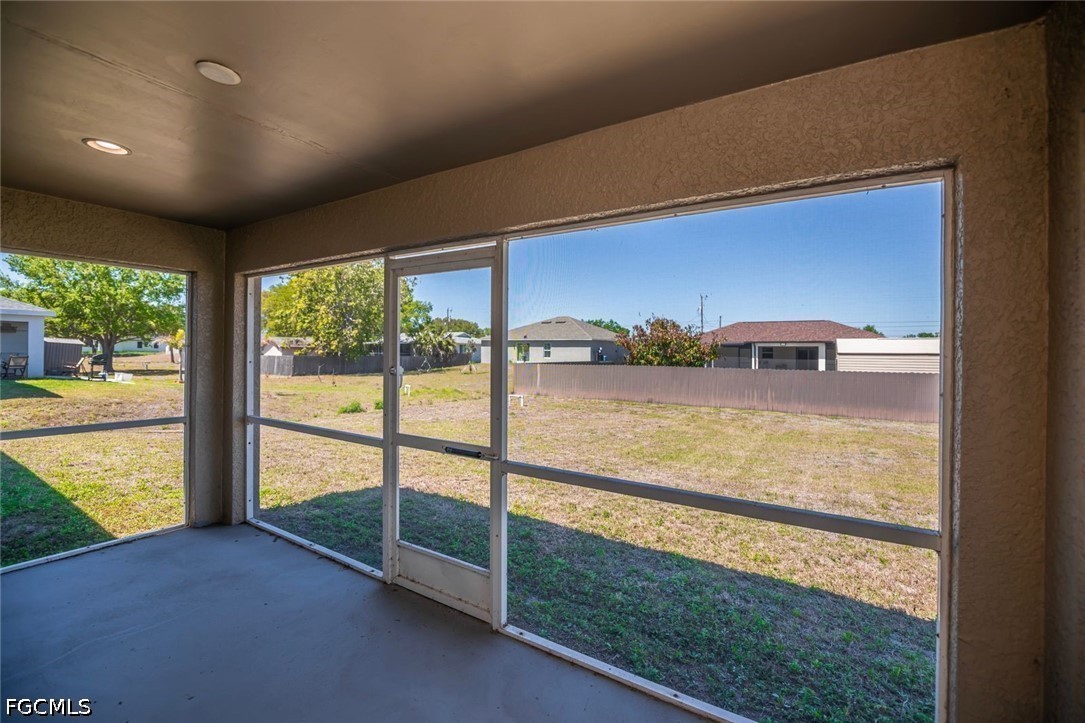 4104 13th Street Southwest Lehigh Acres, FL 33976 - Photo 32 of 46 a view of a living room and floor to ceiling window