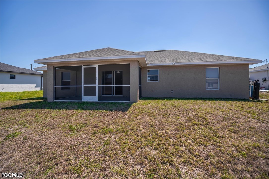 4104 13th Street Southwest Lehigh Acres, FL 33976 - Photo 41 of 46 a house with wooden fence