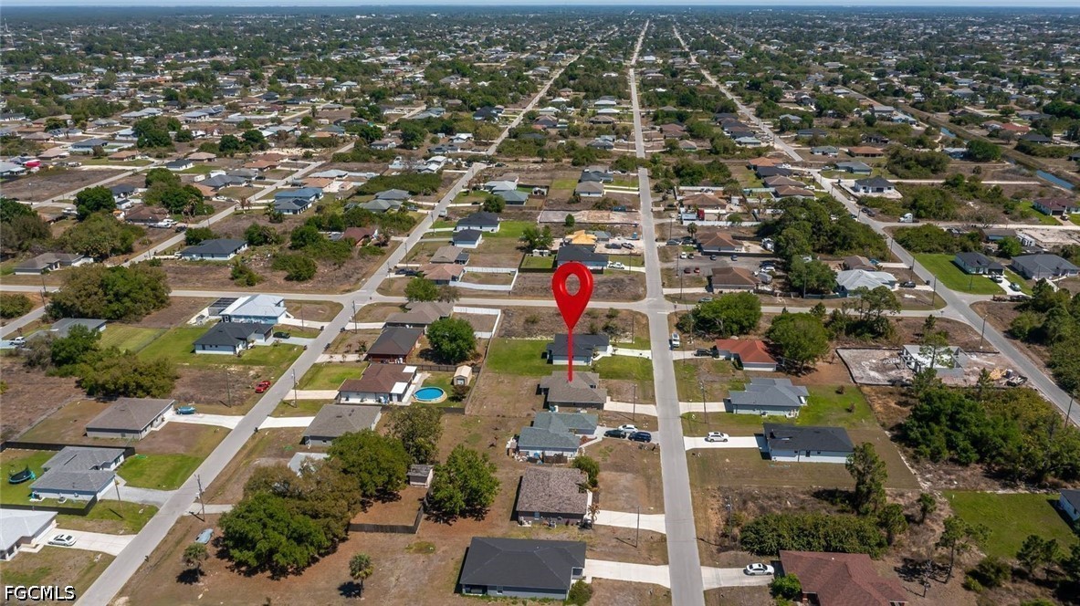 4104 13th Street Southwest Lehigh Acres, FL 33976 - Photo 44 of 46 an aerial view of residential houses with outdoor space