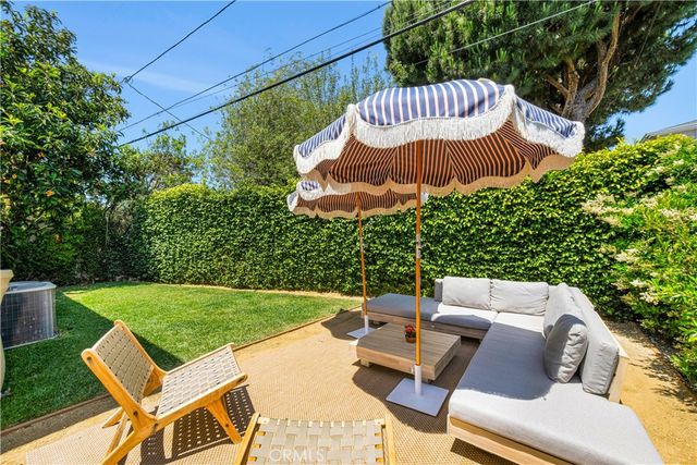 a view of a table and chairs in patio