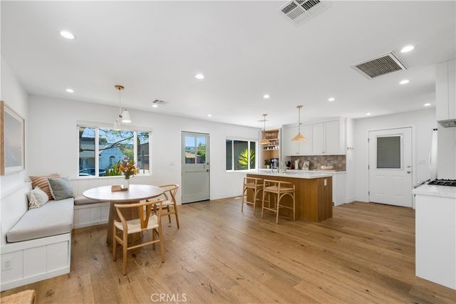 a living room with stainless steel appliances kitchen island granite countertop furniture and a kitchen view