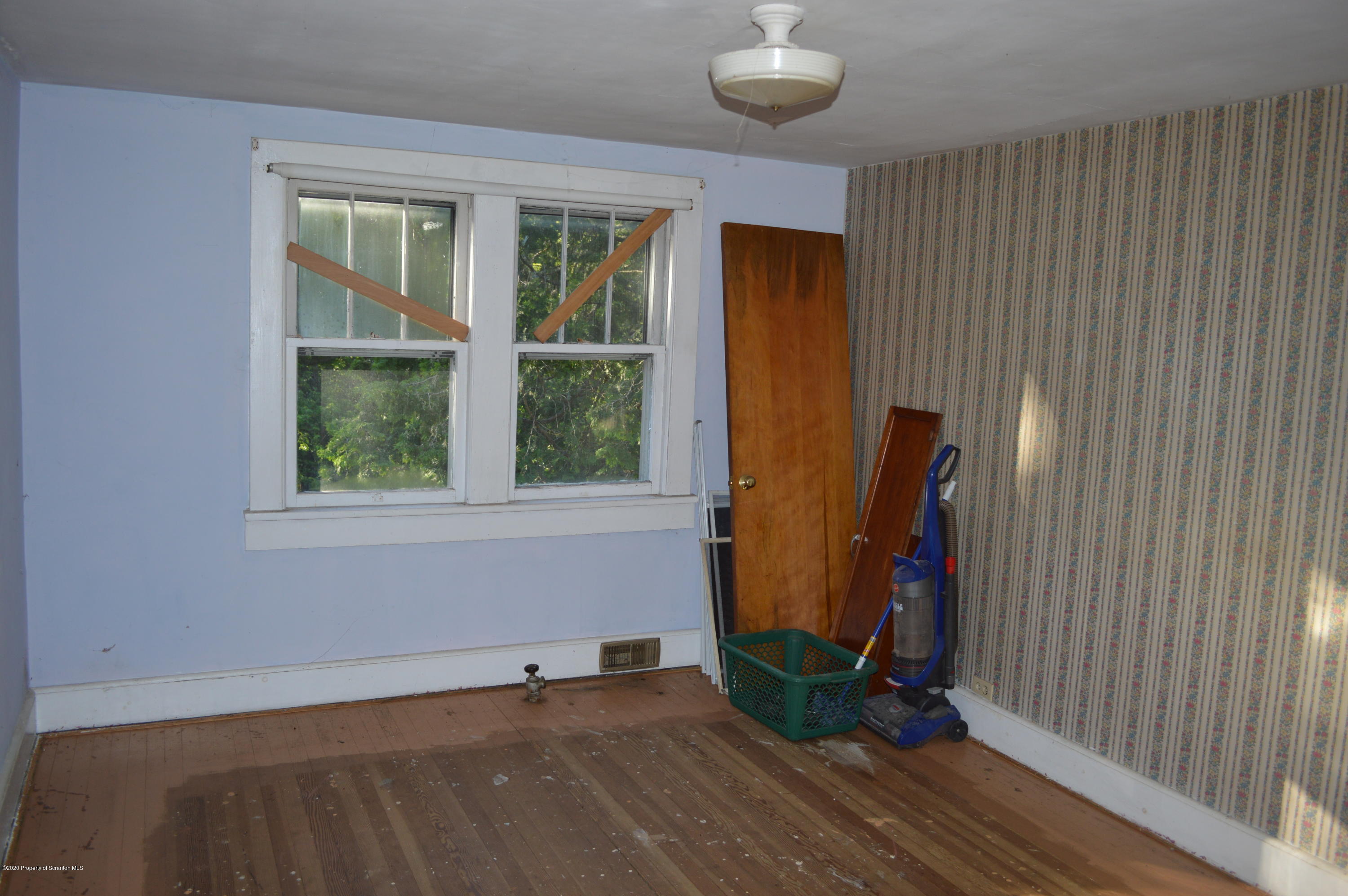 641 Becks Crossing Road Moscow, PA 18444 - Photo 15 of 28 an empty room with a door and windows