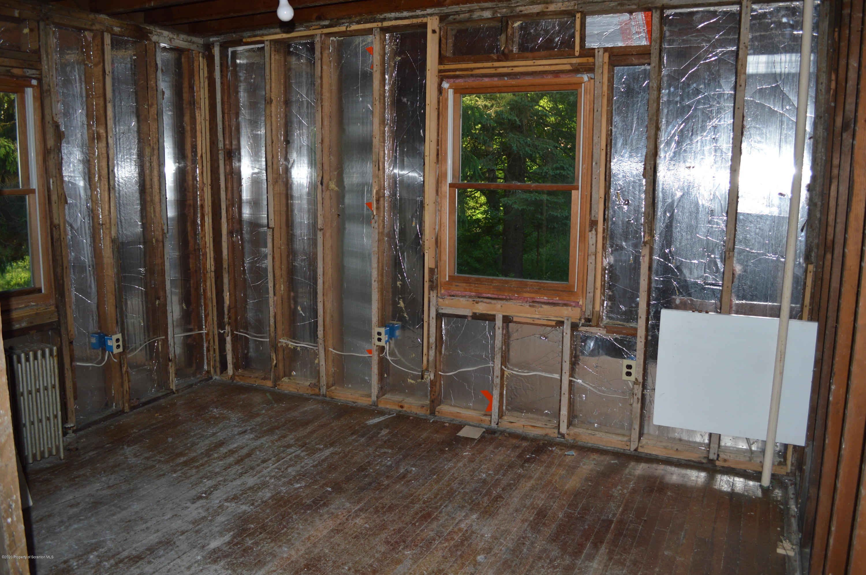 641 Becks Crossing Road Moscow, PA 18444 - Photo 9 of 28 a view of outdoor space with wooden floor and windows