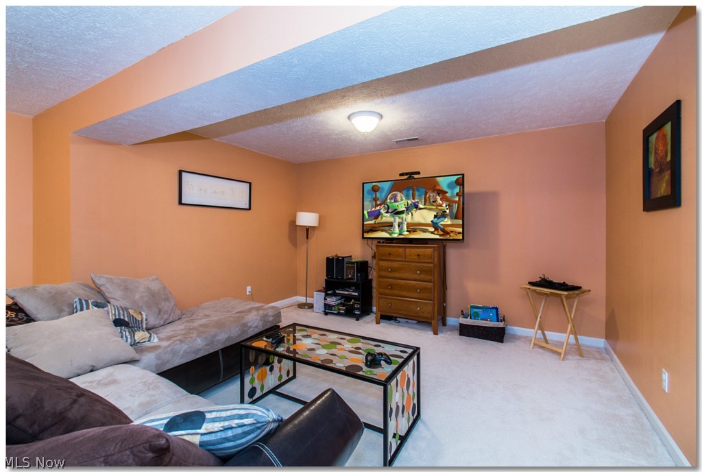 6440 Ruth Drive Seven Hills, OH 44131 - Photo 6 of 24 Finished Basement with additional space for entertaining.