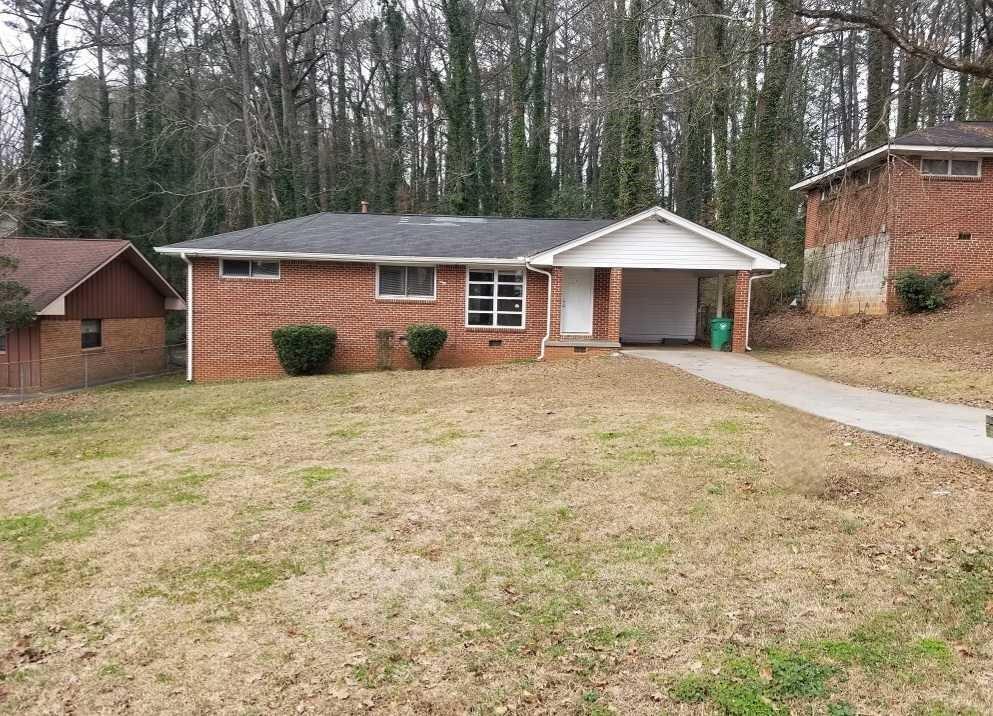 1847 Cindy Drive Decatur, GA 30032 - Photo 1 of 1 a house with trees in front of it