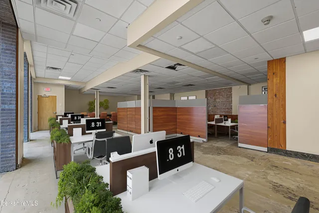 a view of a livingroom with furniture and a window