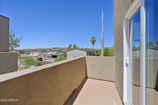 a view of balcony with furniture